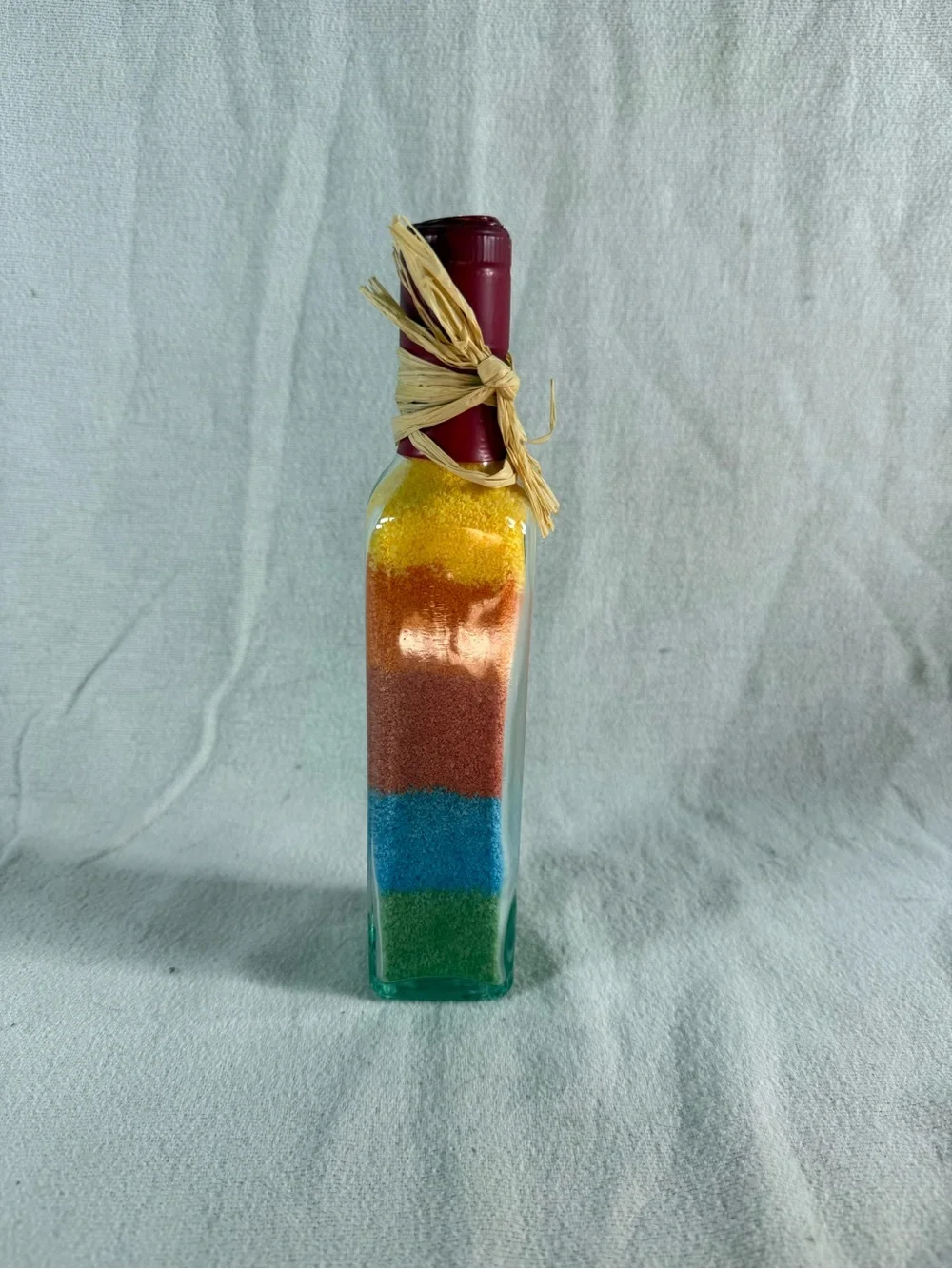 Rainbow Layered Colored Sand Décor in a Glass Wine Bottle